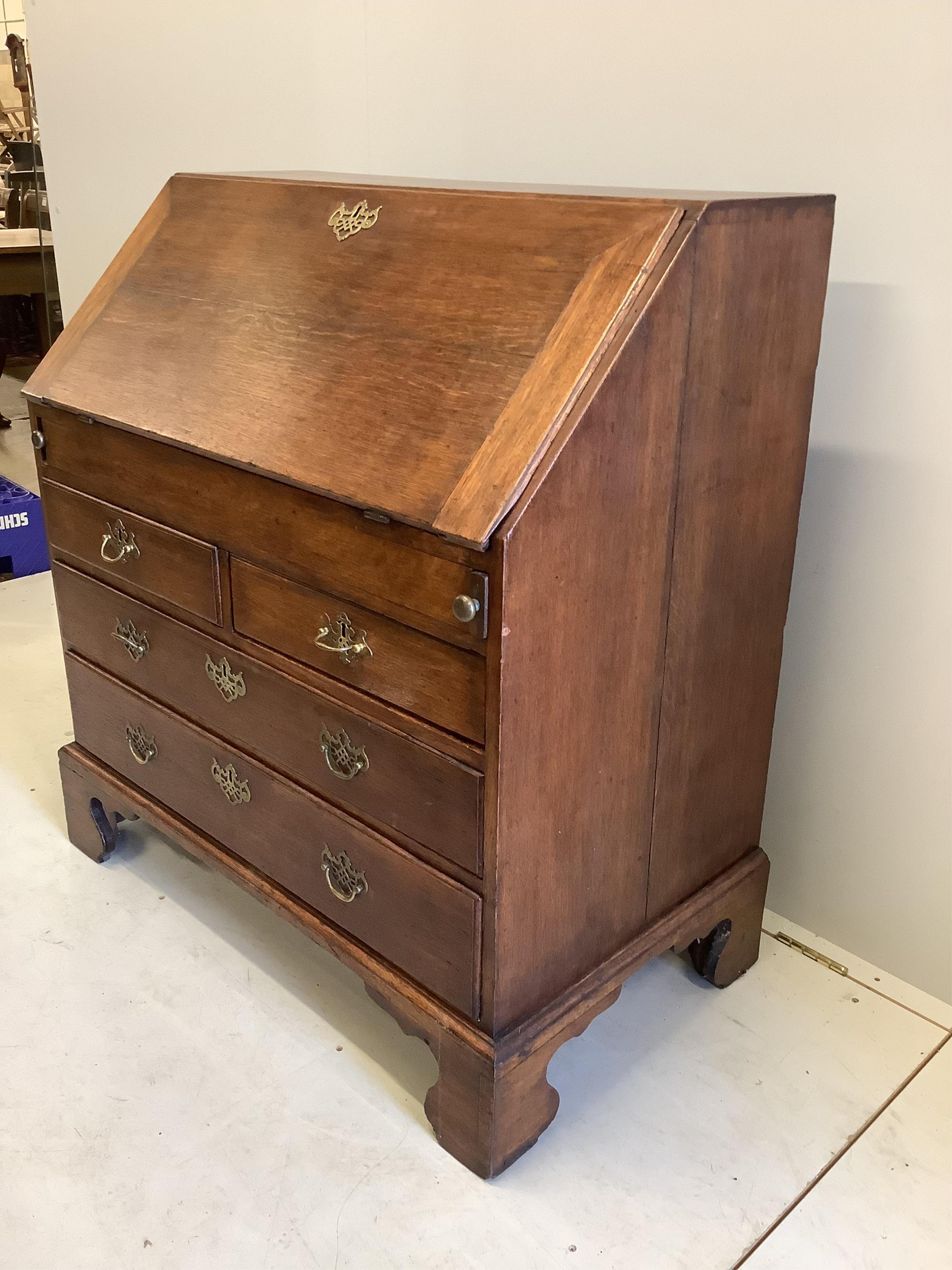 A mid 18th century oak bureau, width 94cm, depth 53cm, height 101cm. Condition - fair